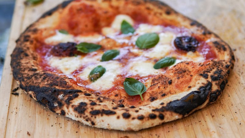 Classic Margherita pizza at Round table pizza